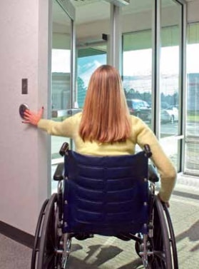Handicapped Woman Pushing on ADA-Compliant Handicap Automatic Door Operator